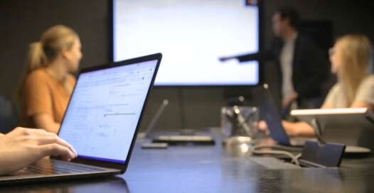 Rocket55 team members work together during a meeting